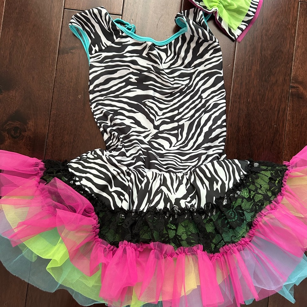Curtain Call child large dance costume with matching bow.
